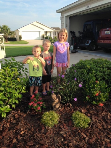 Grand kids plant a memorial garden for Grams